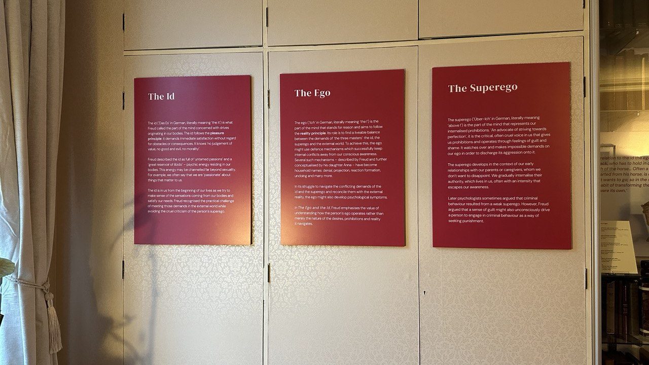 Information panels about the Id, Ego, and Superego (writing on the panels is indistinct)